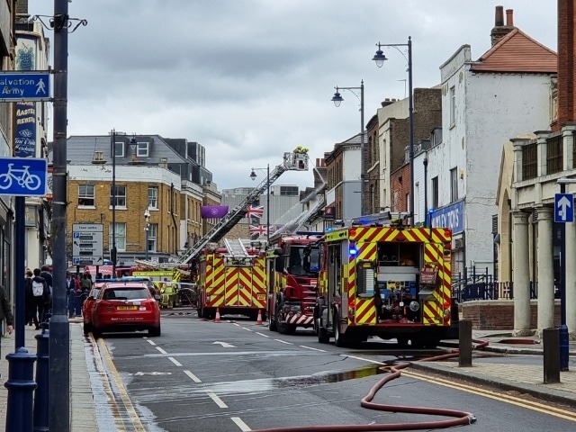 Kent Fire And Rescue Service Remains At The Scene Of A Fire At A Commercial Premises At The Junction Of Queen Street And Milton Road, In Gravesend