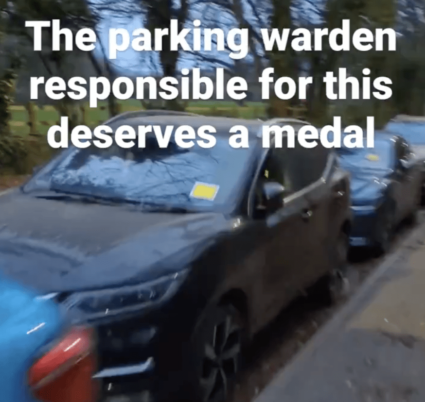 Traffic Warden Takes Action Against Illegally Parked Vehicles Near Football Stadium