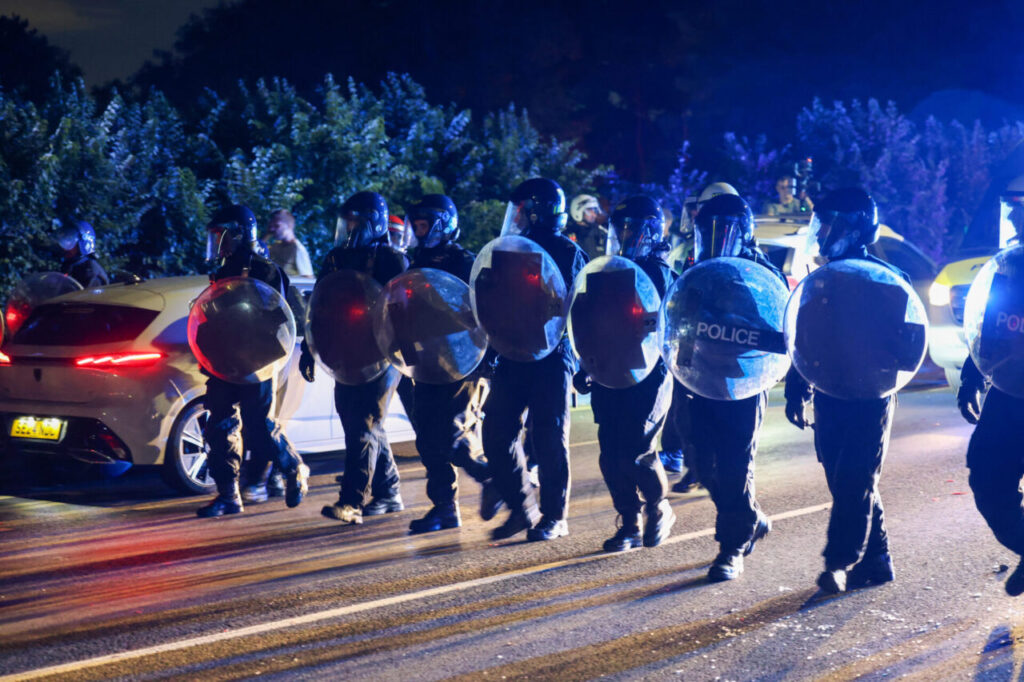 Man Charged with Violent Disorder After Clashes Outside Essex Migrant Hotel – UKNIP