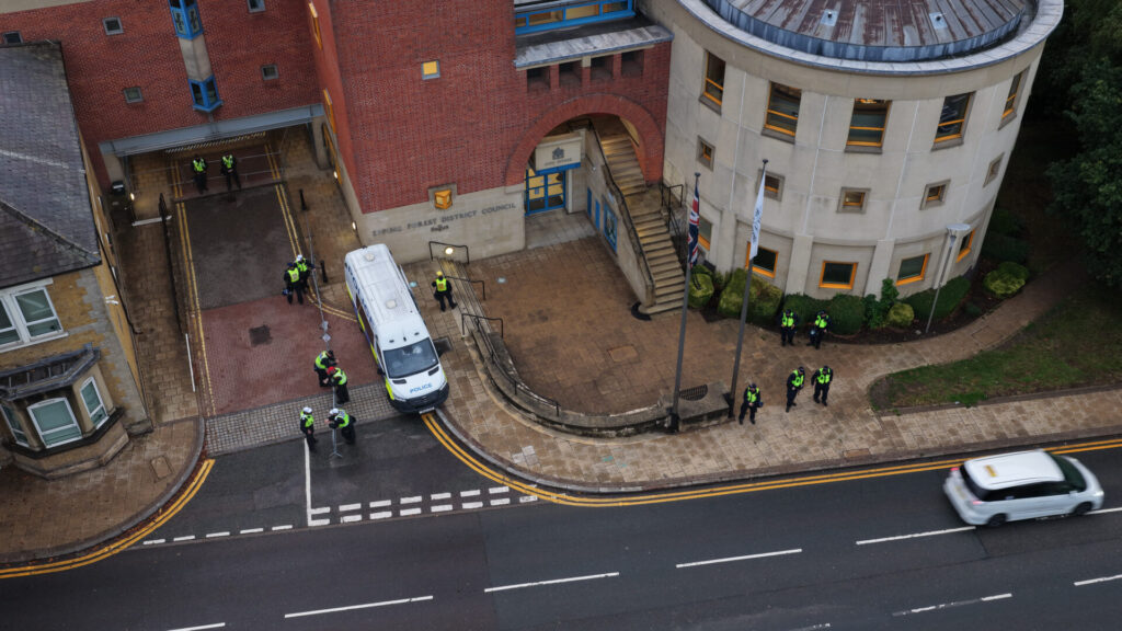 Anti-Migrant Protesters March on Epping Council Offices After Being Fenced in Outside Migrant Hotel