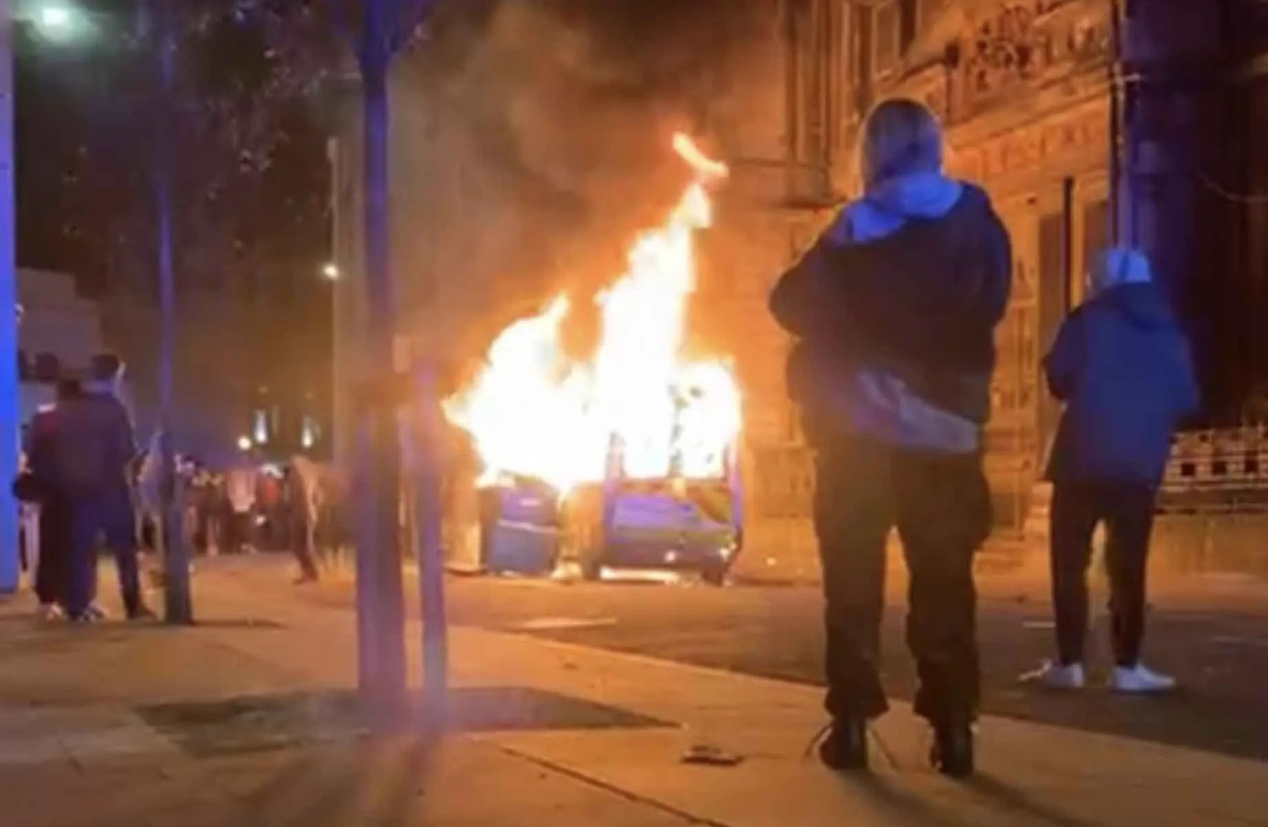 A man has been charged after a lit item was placed under a police van during a Kill the Bill protest