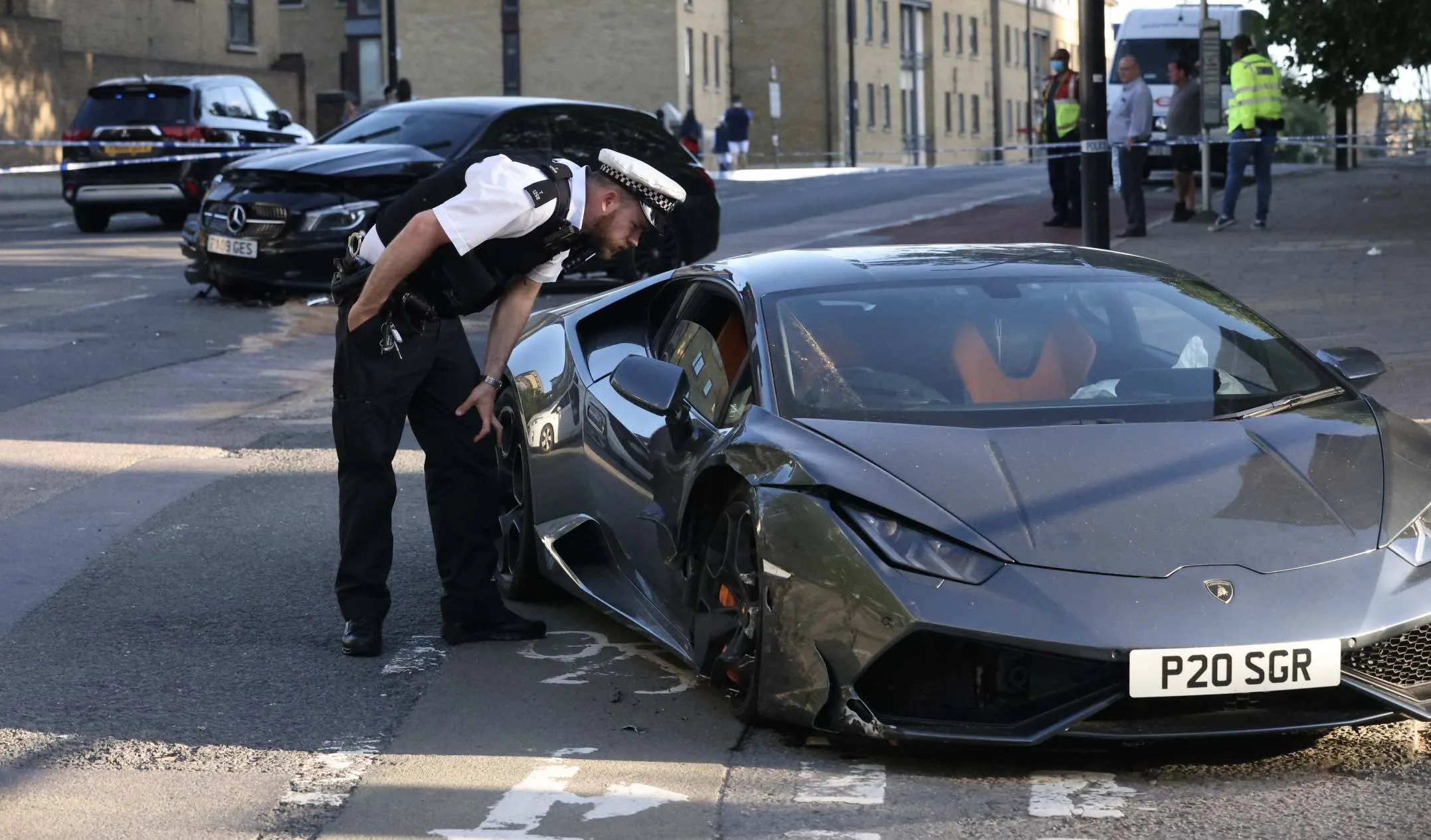 Manhunt launched after driver of Â£200K Lamborghini Huracan  that was racing is  involved in a three vehicle  hit and run collision in London