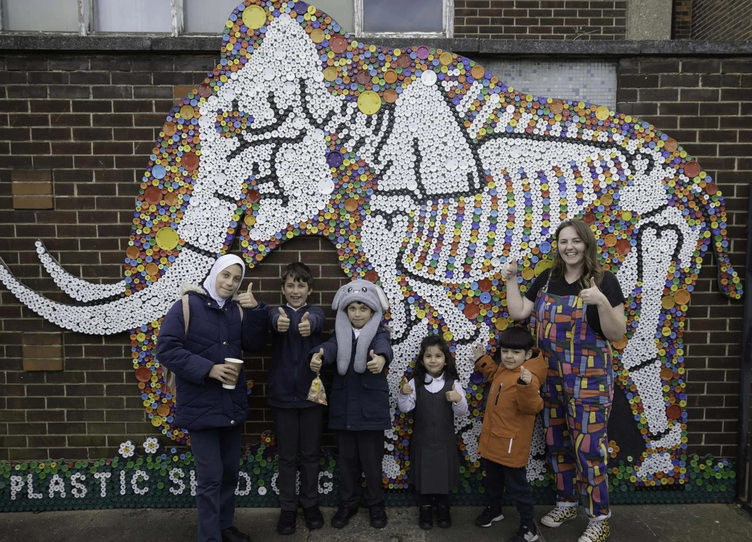 Ilford Kids Recycle 10,000 Bottle Tops to Create Stunning Mammoth Muralâ€”A Prehistoric Eco Masterpiece!