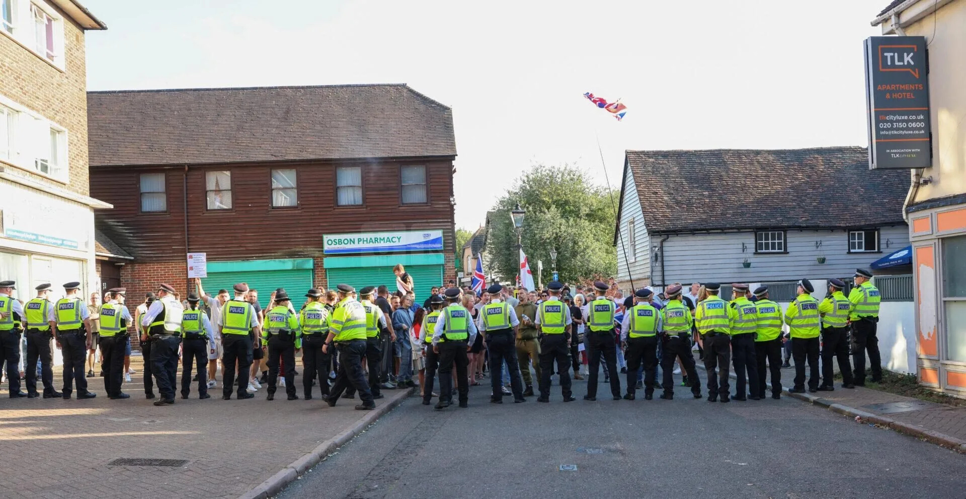 Anti-migrant protesters clash with counter-demonstrators outside hotels across UK as tensions rise