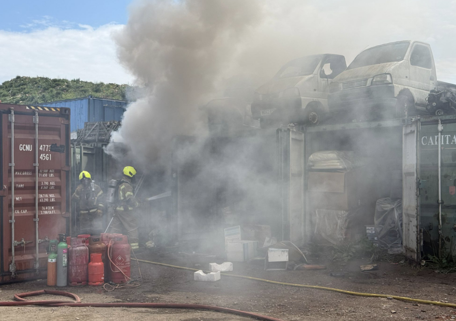 Five Crews Combat Blaze Engulfing Containers and Scrap Vehicles