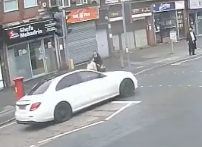 Car speeds towards family at crossing in hate crime investigation