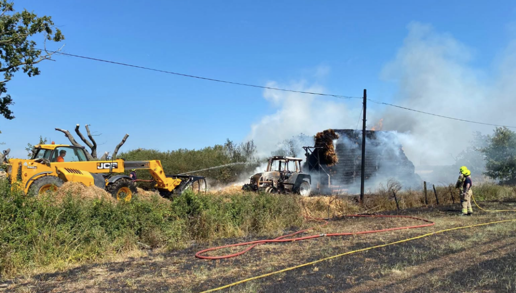 Tractor and Straw Trailer Fire Spreads to Field Near Hullbridge