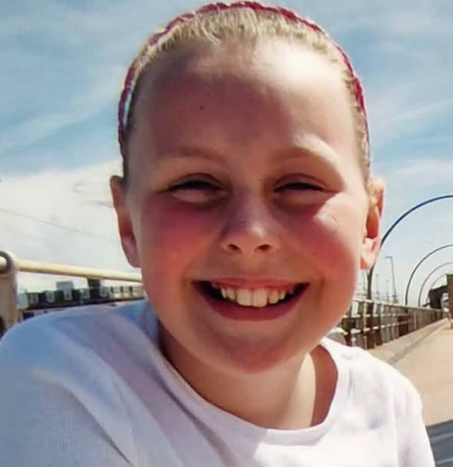 Family pay tribute to nine-year-old Minnie Merriman after death on camping trip as man charged with murder