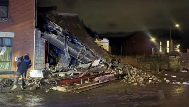 Building collapses after vehicle crashes into shop in Bolton as emergency services rush to scene