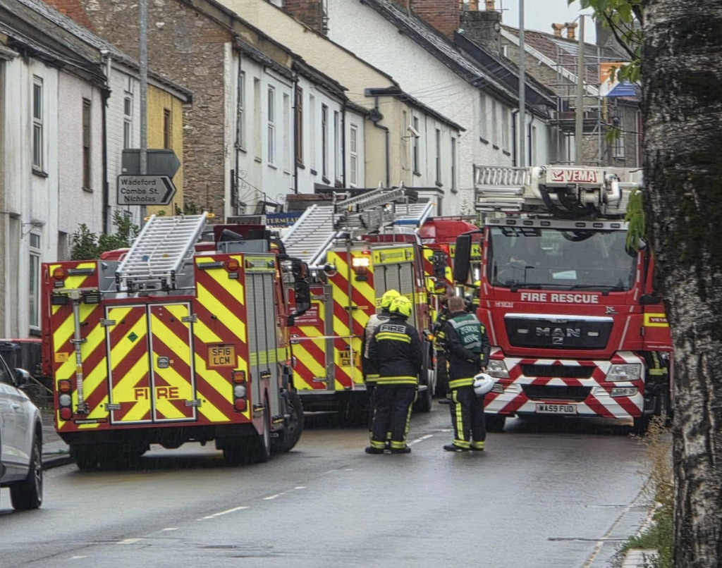 Firefighters tackle house fire after reports people were trapped inside