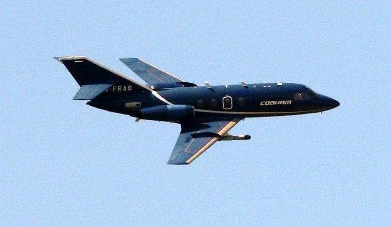 Black Military Style Plane Flying Low Over Cosham In Portsmouth