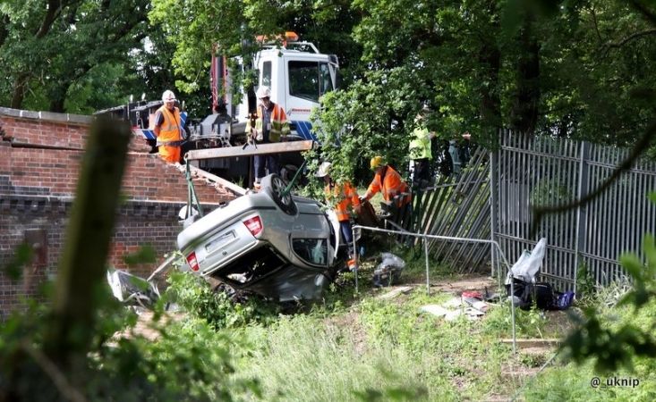 Man Dies After Car Plunges Off Railway Bridge