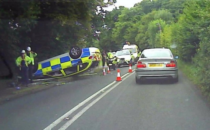 Officers Escape Serious Injury After Police Car Hits Lamp Post And Than Flips
